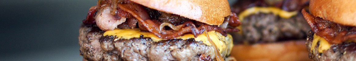 Eating British Burger at Pints Pub- British Gastro Brewpub & Restaurant restaurant in Denver, CO.